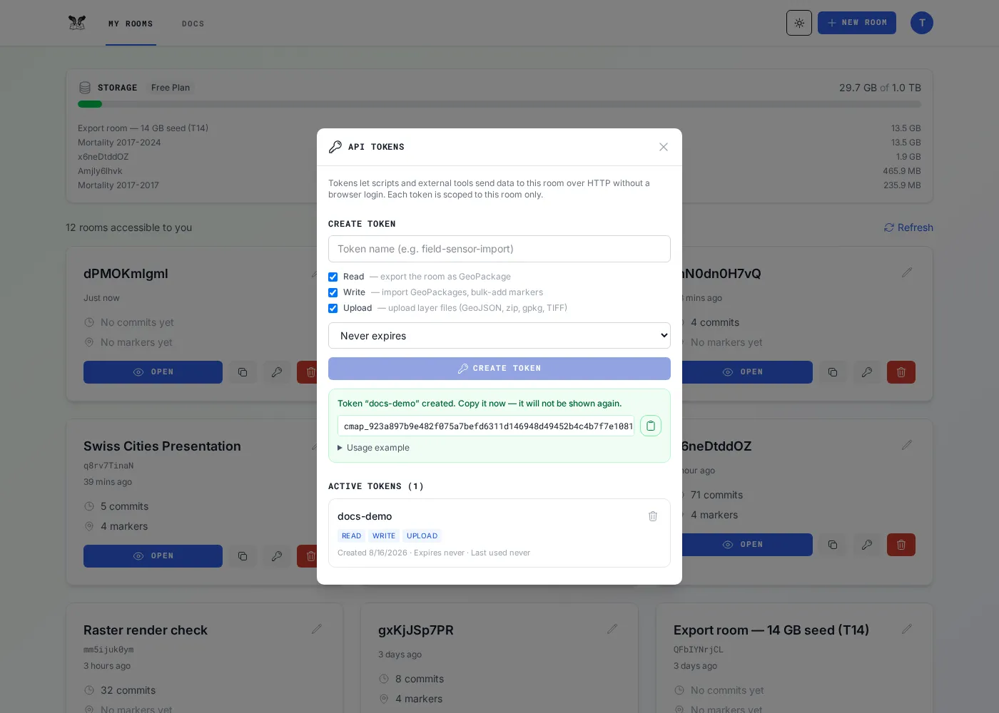 The API Tokens modal showing a freshly minted token secret.